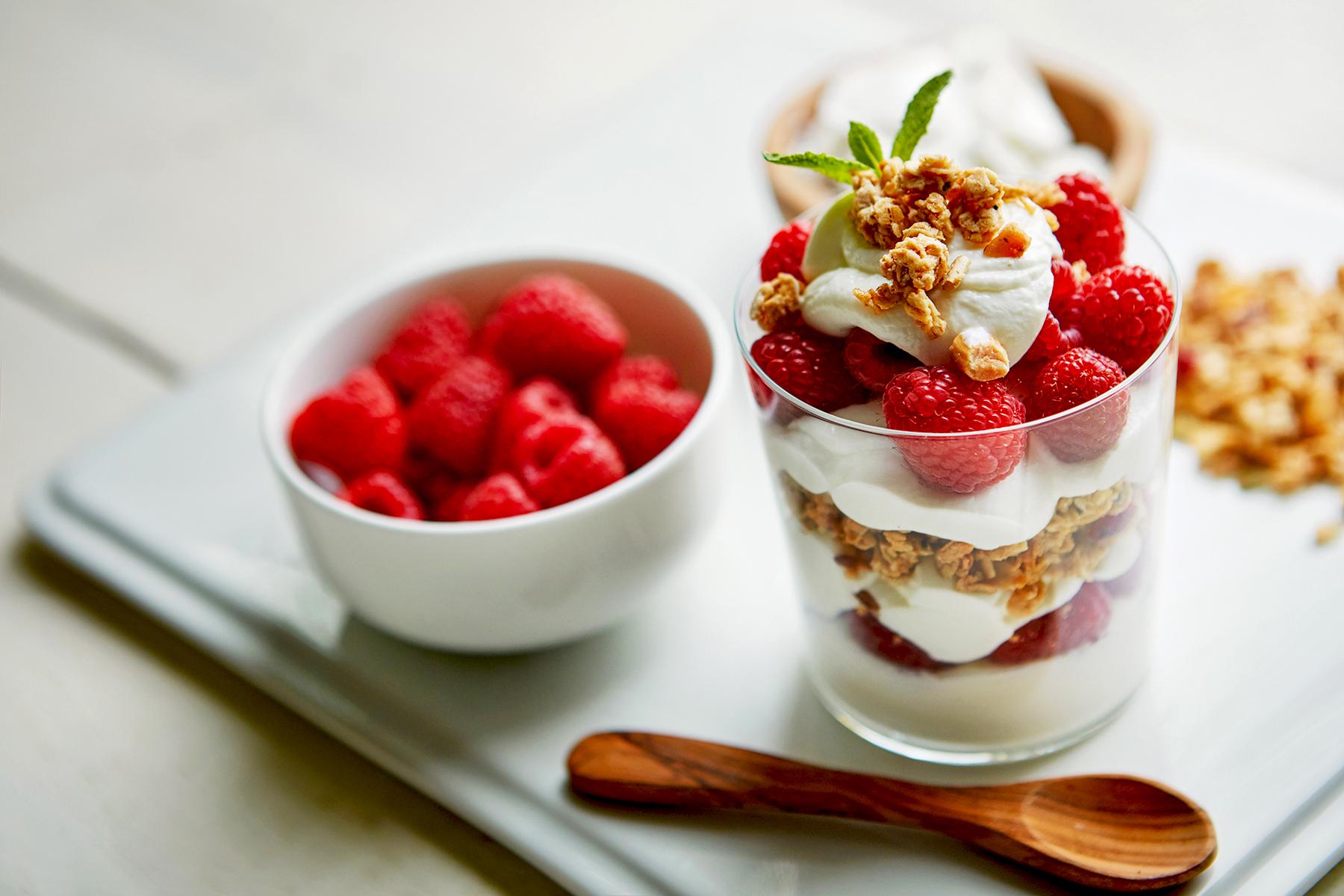 Delicious yogurt parfait with raspberries and granola.