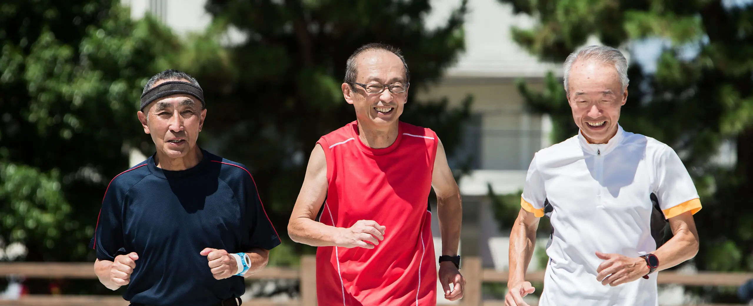 Senior men enjoying jogging with friends.